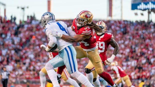 San Francisco 49ers linebacker Fred Warner sacks Dallas Cowboys quarterback Dak Prescott.